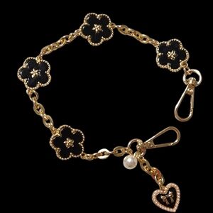 Elegant Gold and Black Floral Charm Bag Charm